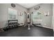 A well-equipped home gym features weight machines, free weights, rubber flooring, and plenty of natural light at 6824 283Rd E St, Myakka City, FL 34251