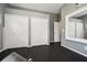 Spacious home gym features black rubber flooring, mirrored wall accents, neutral paint, and closet for equipment storage at 6824 283Rd E St, Myakka City, FL 34251