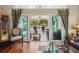 Bright living room with hardwood floors offers seamless access to a covered patio at 6824 283Rd E St, Myakka City, FL 34251