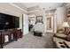 Comfortable living room features television, carpeting, and nearby bathroom and bedrooms at 6824 283Rd E St, Myakka City, FL 34251