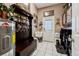 Convenient mud room featuring a sink, bench with storage, and hooks for hats, perfect for organization at 6824 283Rd E St, Myakka City, FL 34251