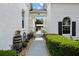 Walkway showing the exterior of the house featuring landscaping and tasteful outdoor decor at 6824 283Rd E St, Myakka City, FL 34251