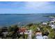 Aerial view of coastal home, beautiful bay, and lush greenery at 770 Yale St, Englewood, FL 34223