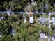 Overhead view of updated home with lush greenery at 770 Yale St, Englewood, FL 34223
