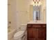 Cozy bathroom featuring a vanity with sink, toilet, and a bathtub with shower at 770 Yale St, Englewood, FL 34223