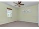 Light, bright bedroom with carpet, a ceiling fan, and large windows offering natural light at 770 Yale St, Englewood, FL 34223