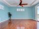 Bright bedroom featuring hardwood flooring, ceiling fan and natural lighting at 770 Yale St, Englewood, FL 34223