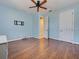 This airy bedroom has hardwood floors, ceiling fan, and closet at 770 Yale St, Englewood, FL 34223