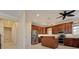Kitchen featuring stainless steel appliances, wood cabinetry, and a central island at 770 Yale St, Englewood, FL 34223