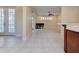 Large living area with tile flooring, ample natural light, and access to outdoor spaces at 770 Yale St, Englewood, FL 34223