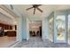 Bright, screened-in lanai offering a view of the kitchen, dining room and beautiful surroundings at 770 Yale St, Englewood, FL 34223