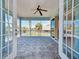 Enjoy the outdoors on this spacious screened-in lanai with tiled flooring and scenic neighborhood views at 770 Yale St, Englewood, FL 34223
