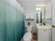 Cozy bathroom with a neutral color palette, shower-tub combination, and vanity at 791 Cumberland Rd, Venice, FL 34293