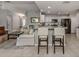 Open living space with view to kitchen featuring tiled floors and neutral color palette at 791 Cumberland Rd, Venice, FL 34293