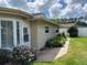 Nice backyard, complemented by lush landscaping, a convenient walkway, and a fenced area at 810 Anchorage Ln, Palm Harbor, FL 34685