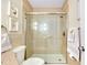 Bathroom featuring a walk-in shower with glass doors and updated fixtures at 810 Anchorage Ln, Palm Harbor, FL 34685