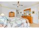 Relaxing bedroom with coordinating furnishings, carpet, and a ceiling fan at 810 Anchorage Ln, Palm Harbor, FL 34685