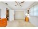 Bright bedroom with closet space, carpet flooring, side tables, and decor at 810 Anchorage Ln, Palm Harbor, FL 34685