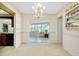Dining room with access to sunroom and view of kitchen at 810 Anchorage Ln, Palm Harbor, FL 34685