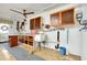 Garage features built-in storage, sink, utility shelving and a ceiling fan at 810 Anchorage Ln, Palm Harbor, FL 34685