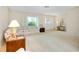 Open living room with neutral tones, front door view, and comfortable seating at 810 Anchorage Ln, Palm Harbor, FL 34685