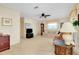 Inviting living room featuring plush seating, carpet, and a ceiling fan at 810 Anchorage Ln, Palm Harbor, FL 34685