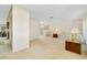 Spacious living room with neutral carpeting and décor, offering a comfortable living space at 810 Anchorage Ln, Palm Harbor, FL 34685