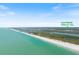 Wide aerial shot revealing coastal beauty, showcasing lush islands and waterways with an address locator pinpointing 