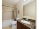 Bathroom featuring a granite countertop and a bathtub with shower at 8403 Placida Rd # 304, Placida, FL 33946