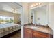 Bathroom with granite counters, and doorway leading to the main bedroom at 8403 Placida Rd # 304, Placida, FL 33946