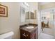 Bathroom vanity with granite countertop and view to dining area at 8403 Placida Rd # 304, Placida, FL 33946