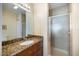 Bathroom featuring granite countertop and glass shower at 8403 Placida Rd # 304, Placida, FL 33946