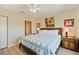 Bedroom featuring a queen-size bed with side tables and bright natural light at 8403 Placida Rd # 304, Placida, FL 33946