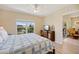 Bedroom with a queen-sized bed and a view to the outdoor balcony and television at 8403 Placida Rd # 304, Placida, FL 33946