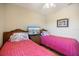 Bedroom featuring twin beds and a shared nightstand with a television at 8403 Placida Rd # 304, Placida, FL 33946