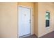 Condo front door with hardware, entry to a welcoming and well-maintained living space at 8403 Placida Rd # 304, Placida, FL 33946