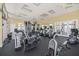 Fully equipped gym featuring a variety of machines, mirrors, and ample space for a comprehensive workout routine at 8403 Placida Rd # 304, Placida, FL 33946