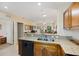 Kitchen with granite counters offers a seamless view to living area, fostering connectivity and effortless entertaining at 8403 Placida Rd # 304, Placida, FL 33946