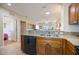Modern kitchen with granite countertops and stainless steel dishwasher, offering an open layout to the living area at 8403 Placida Rd # 304, Placida, FL 33946