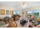 Open living room area featuring a ceiling fan, comfortable seating, and access to the outdoor balcony at 8403 Placida Rd # 304, Placida, FL 33946