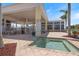 Outdoor pool with chairs and tables under covered patio with ceiling fans for relaxing enjoyment at 8403 Placida Rd # 304, Placida, FL 33946