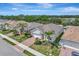 Desirable neighborhood featuring manicured lawns, mature landscaping, and charming homes with brick driveways at 8997 Excelsior Loop, Venice, FL 34293