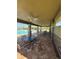 A shaded outdoor lounge area by the community pool at 8997 Excelsior Loop, Venice, FL 34293