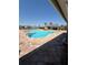 Community pool with ample seating and lounging at 8997 Excelsior Loop, Venice, FL 34293