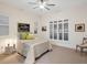 Cozy bedroom with bright, sunlit windows, neutral walls and decor, and carpeted floors at 9810 Eagle Preserve Dr, Englewood, FL 34224