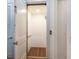 Convenient residential elevator featuring wood floors, white walls, and silver trim, offering accessibility and comfort at 9810 Eagle Preserve Dr, Englewood, FL 34224