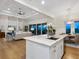 Contemporary kitchen with a center island, seamlessly connecting to a living area for a cozy atmosphere at 9810 Eagle Preserve Dr, Englewood, FL 34224
