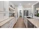 Bright modern kitchen featuring stainless steel appliances, custom cabinetry, and sleek design details at 9810 Eagle Preserve Dr, Englewood, FL 34224