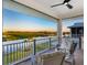 Unwind on the patio with comfortable seating and views of the lush golf course at 9810 Eagle Preserve Dr, Englewood, FL 34224