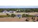 Wide aerial view of home and surrounding neighborhood with scattered houses and foliage at 10153 Gasparilla Rd, Placida, FL 33946